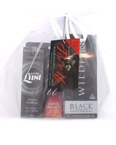 Romantic gift for him featuring the Fire It Up - Black gift set with Wildfire's Black Pleasure Oil, Fire It Up Warming Arousal Oil, and Lust Mood Mist.