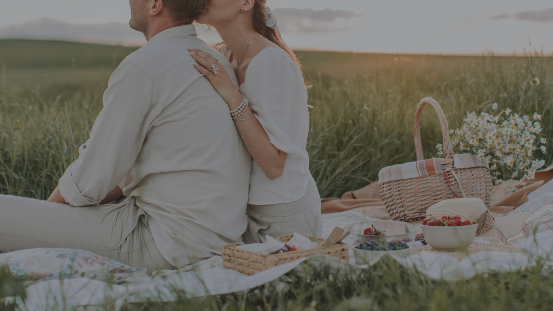 Romantic couple sharing a picnic outdoors, showcasing relationship goals for 2025.