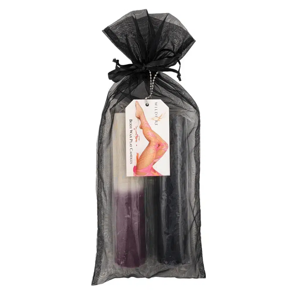 Wildfire Candles for Wax Play set featuring Black and Purple & White candles, elegantly packaged in a black organza bag with a product tag attached.