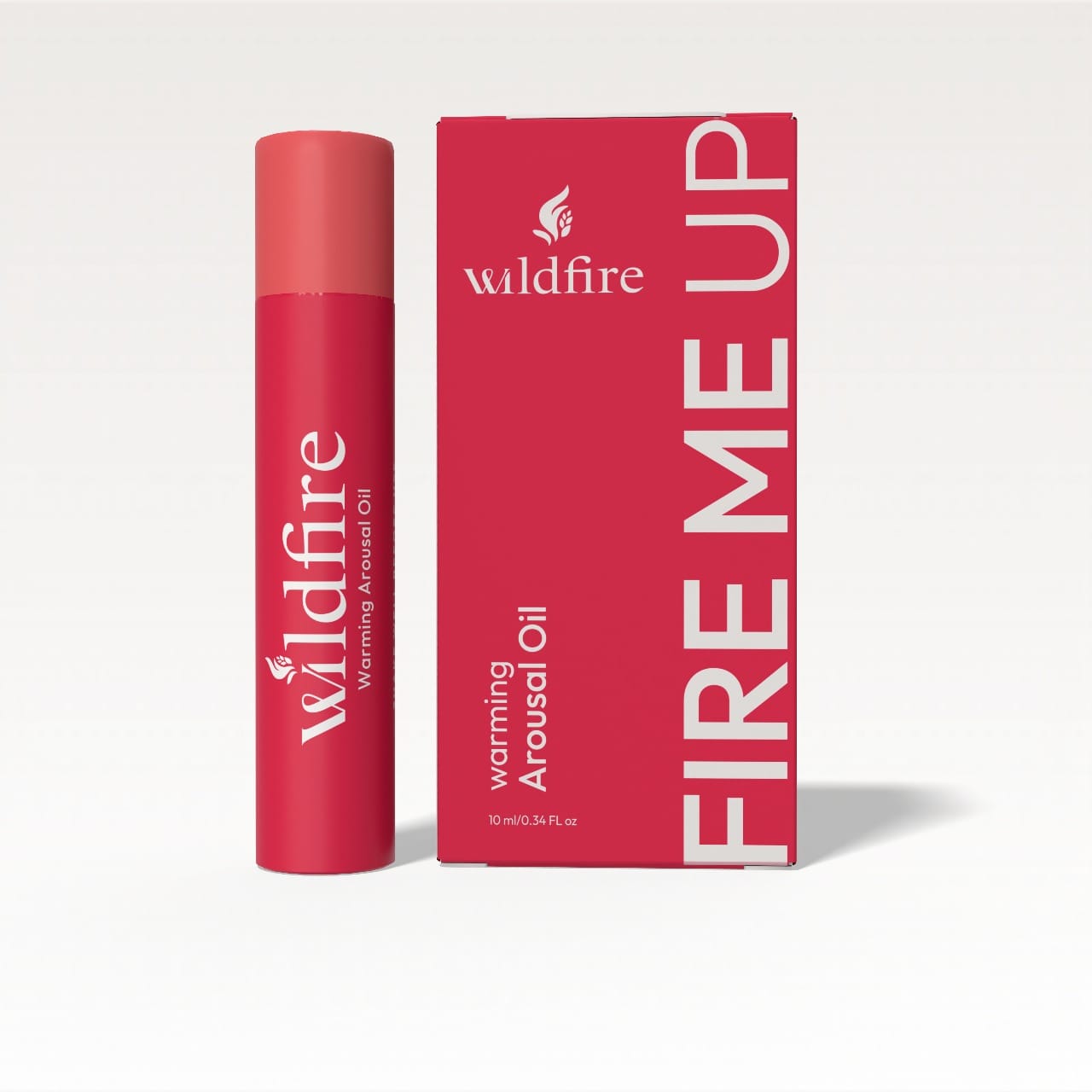 Wildfire Fire Me Up Warming Arousal Oil - Arousing oil in a sleek red bottle with matching box, featuring bold white typography and elegant branding